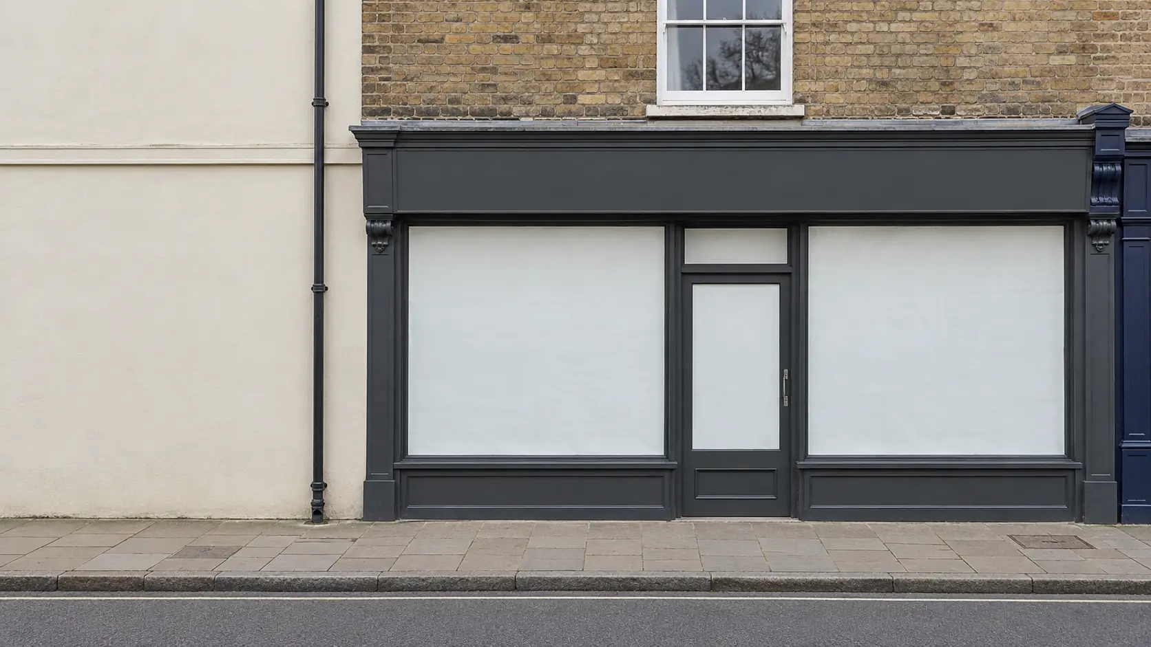 A vacant shopfront with a blank fascia, used to preview your sign